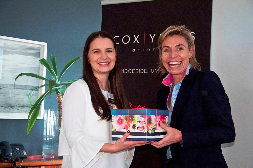 Jenna Padoa of Cox Yeats presenting Lee den Hond with her gift.
